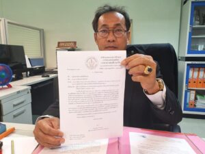 Director Wibun Champaen, from the office of the Boxing Committee, signs order on July 2