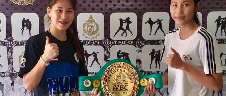 sanaejan and buakaw at weigh ins with wbc muaythai belt. they became the first women to grace the lumpinee boxing stage