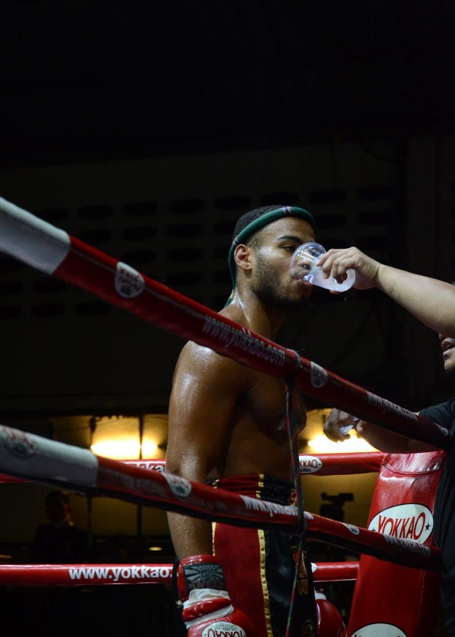 boxer drinking water on ring