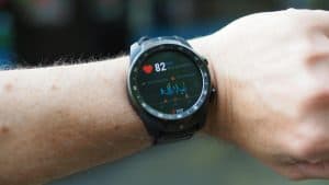 person wearing a heart rate monitor smartwatch