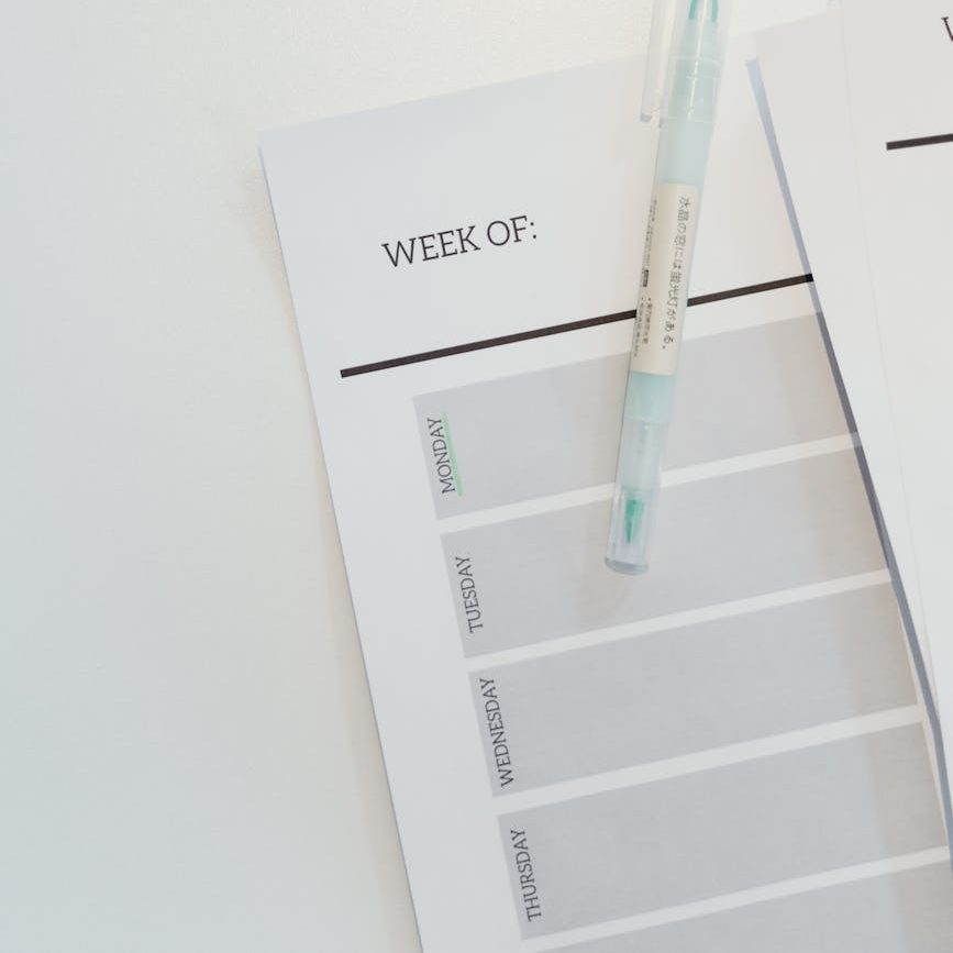 pen on top of a planner