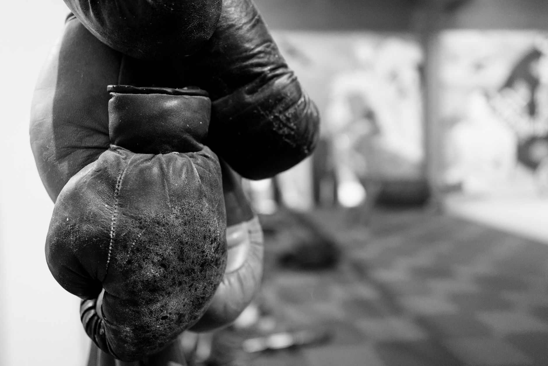 grayscale photo of boxing gloves